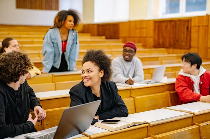 Students in a university classroom, representing the education sector that consultancy SEO helps reach