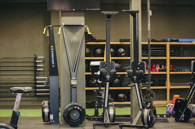 A modern gym with exercise equipment and weights, the type of fitness center that SEO helps attract members to