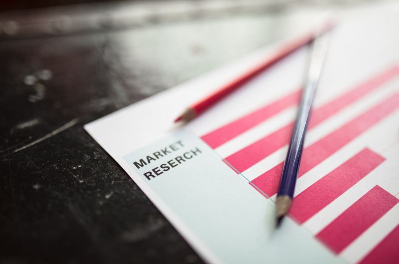 Research papers with graphs and data charts used to measure and track SEO campaign performance