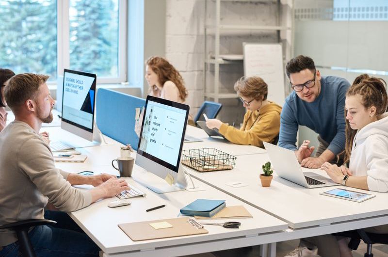 A team working together on optimizing copy for search results and meta descriptions