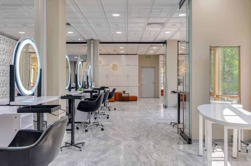 A modern beauty salon interior with styling stations and mirrors, the kind of business that local SEO promotes