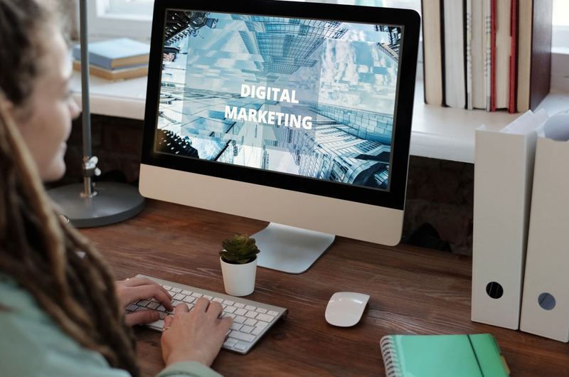 A digital marketer working on a project at her desk, showing the daily work of an SEO professional