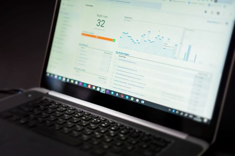 A laptop showing analytics data, the kind of metrics used to compare SEO and PPC performance