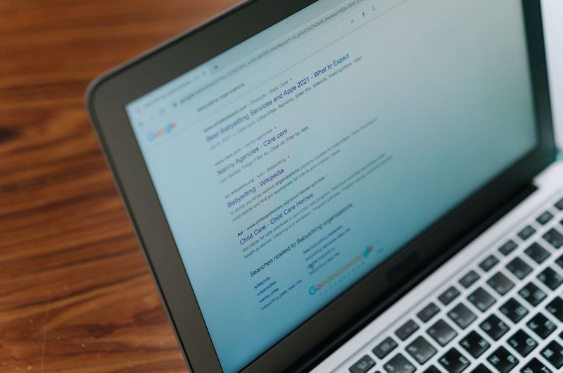A laptop displaying a clean search interface, representing the fast-loading experience that site speed optimization delivers