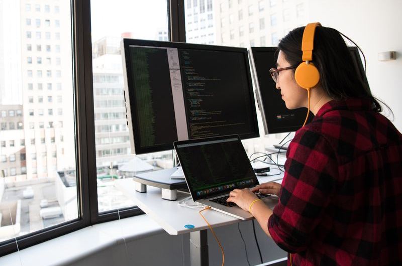 A developer reviewing server response codes and crawl data during a technical SEO check