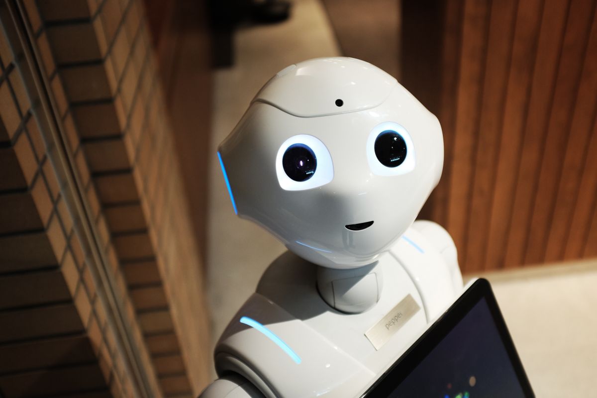 A friendly white humanoid robot, representing the AI engines that now answer search queries