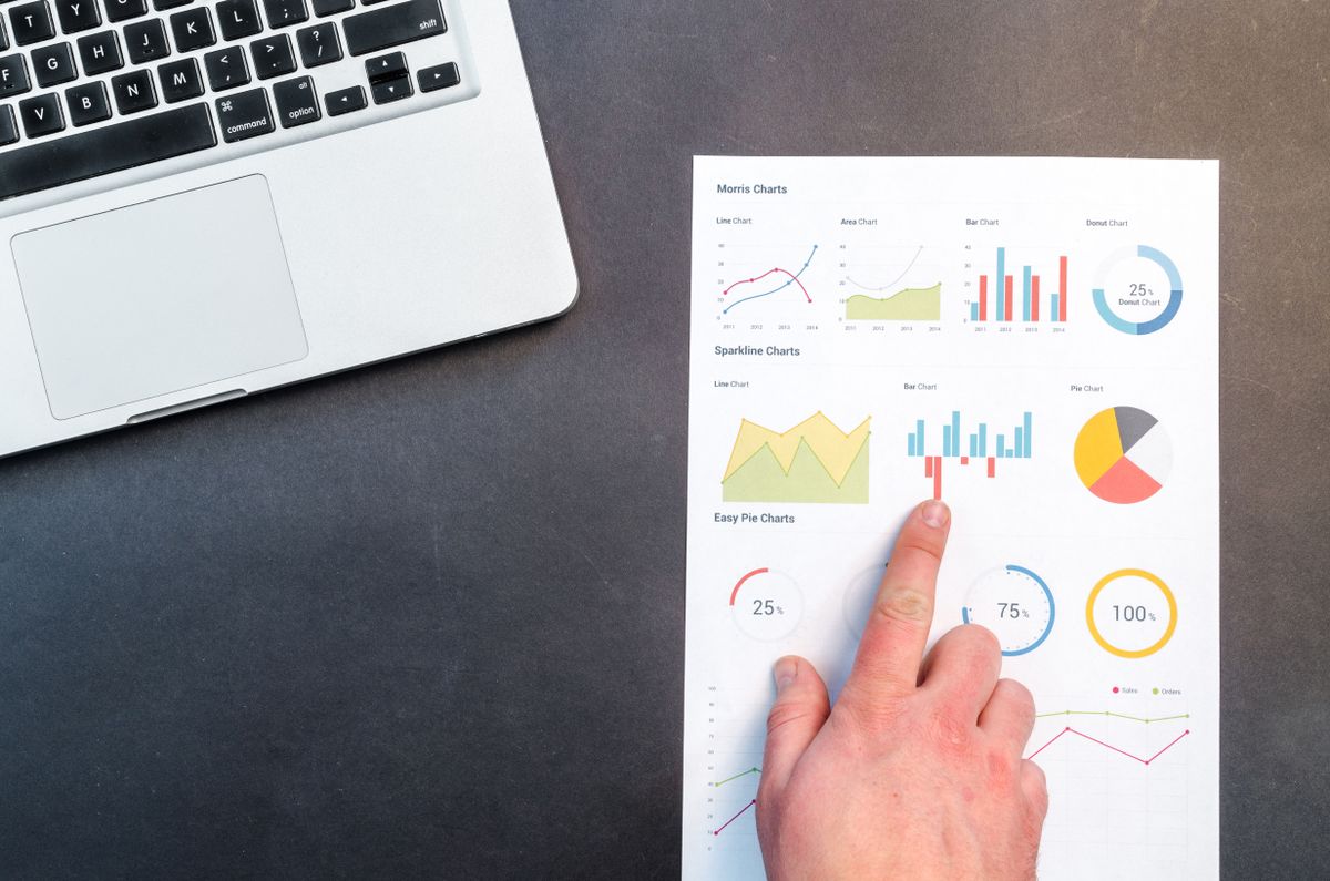 An organised desk workspace where SEO tools and keyword data are reviewed