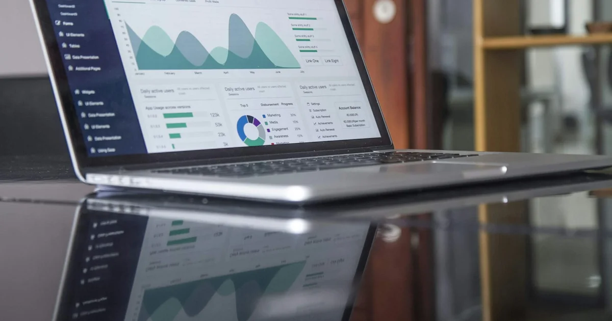 Laptop displaying analytics charts, used as a stock illustration rather than GA4 evidence