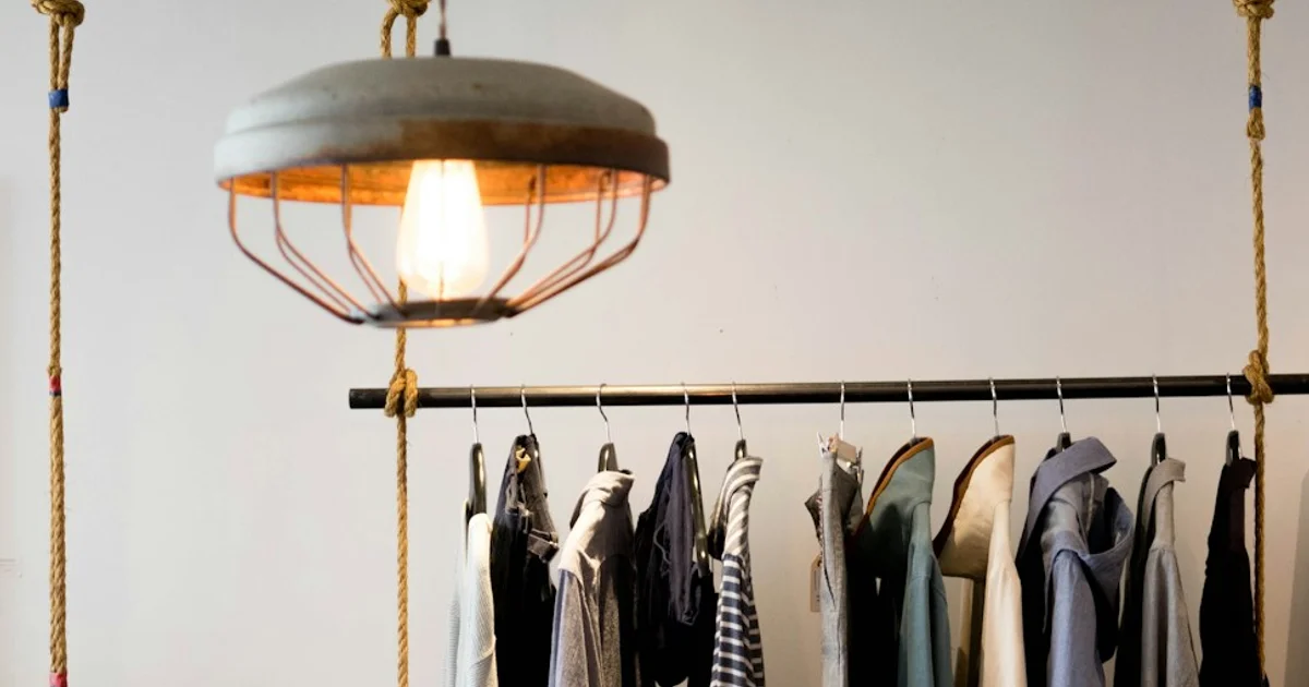 Clothing arranged on hanging racks, illustrating products grouped by attributes