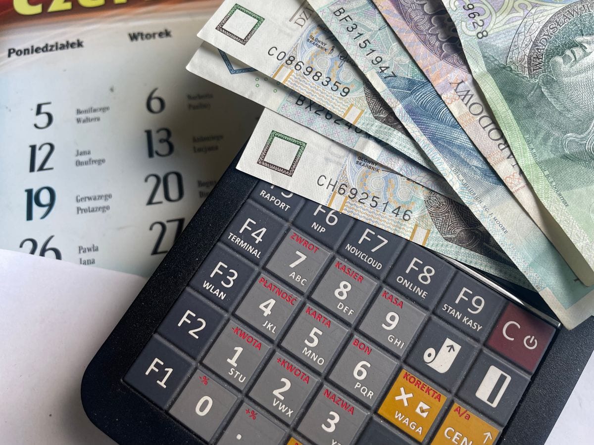 A calculator resting on banknotes, used to weigh up the cost of SEO