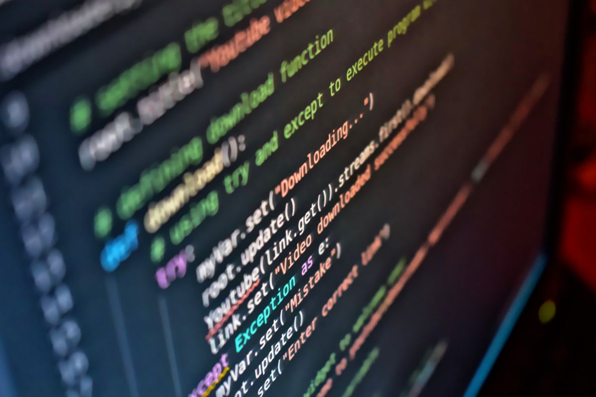 Code and performance figures on a screen while a website is optimised for speed