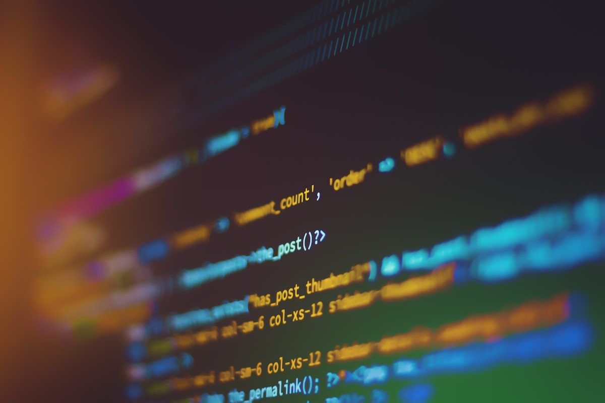 Code on a screen representing the HTML meta description tag that appears in search results