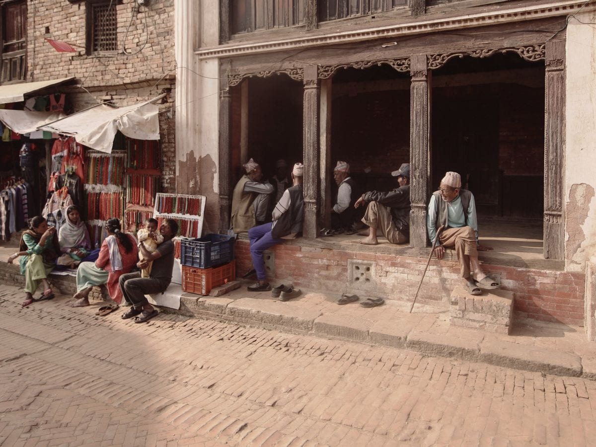 A lively local market scene in Nepal, full of neighbourhood businesses
