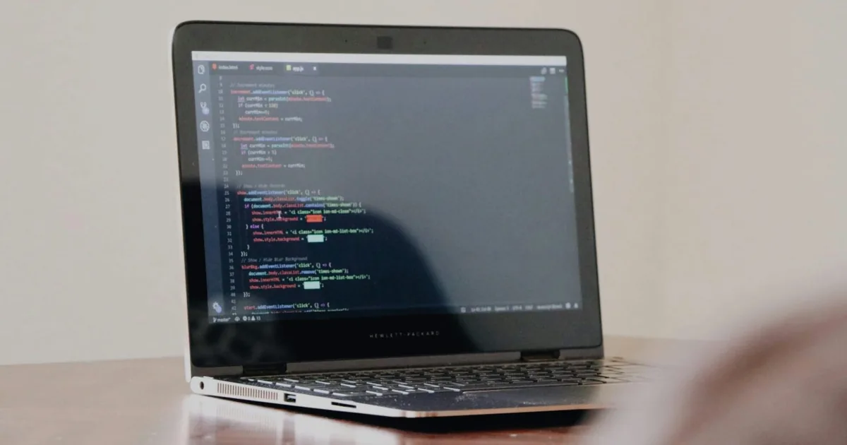 Laptop displaying programming code, illustrating Next.js missing-route debugging.