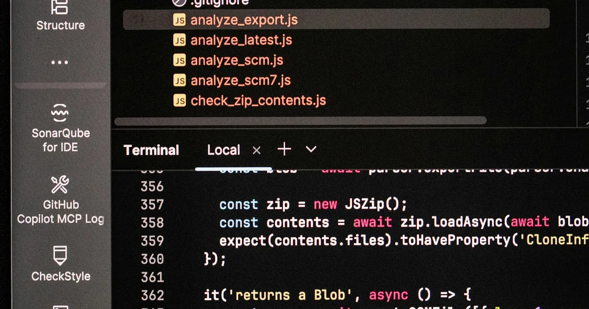Computer monitor showing code and terminal output, illustrating Next.js sitemap debugging.