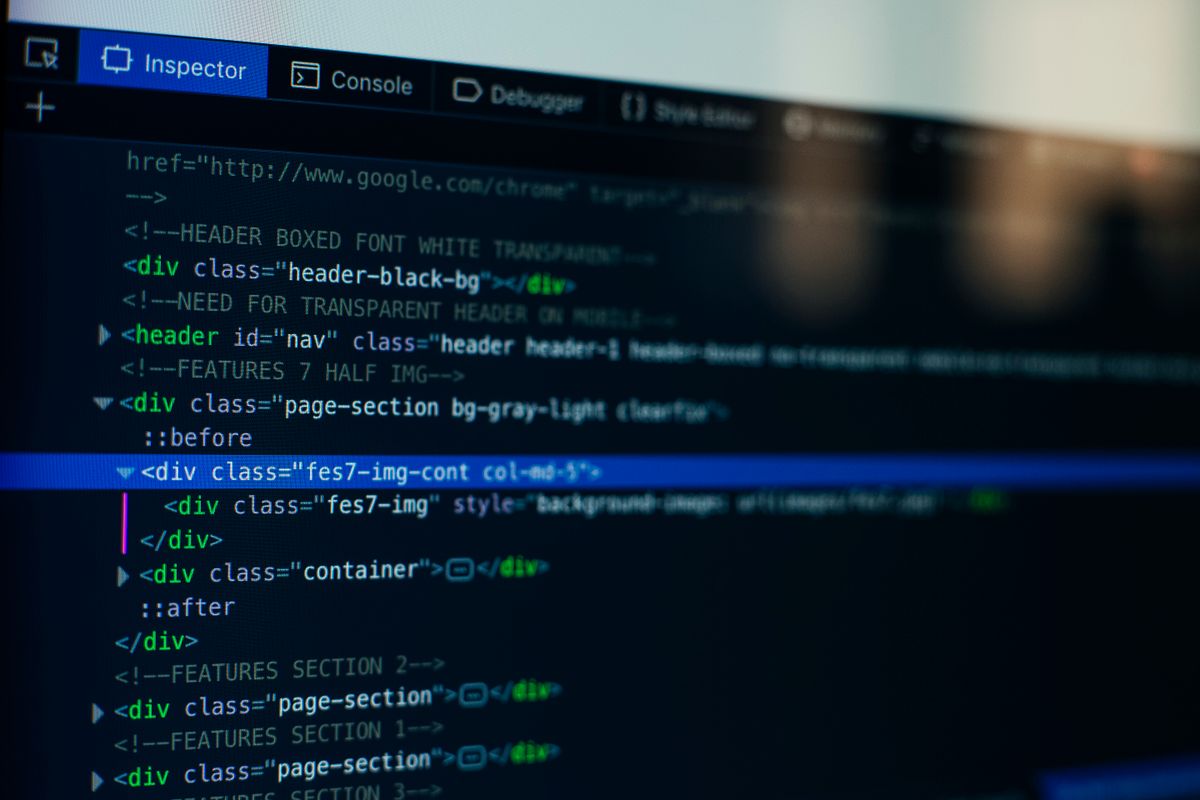 A laptop screen of code, the WordPress environment where SEO plugins like Rank Math and Yoast run