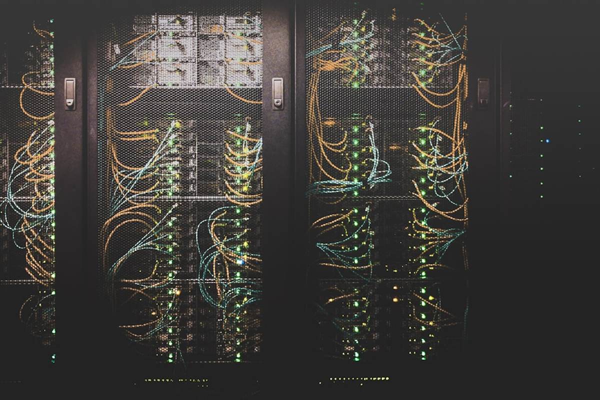 Server room with blue LED lights representing web crawlers accessing website files through robots.txt directives