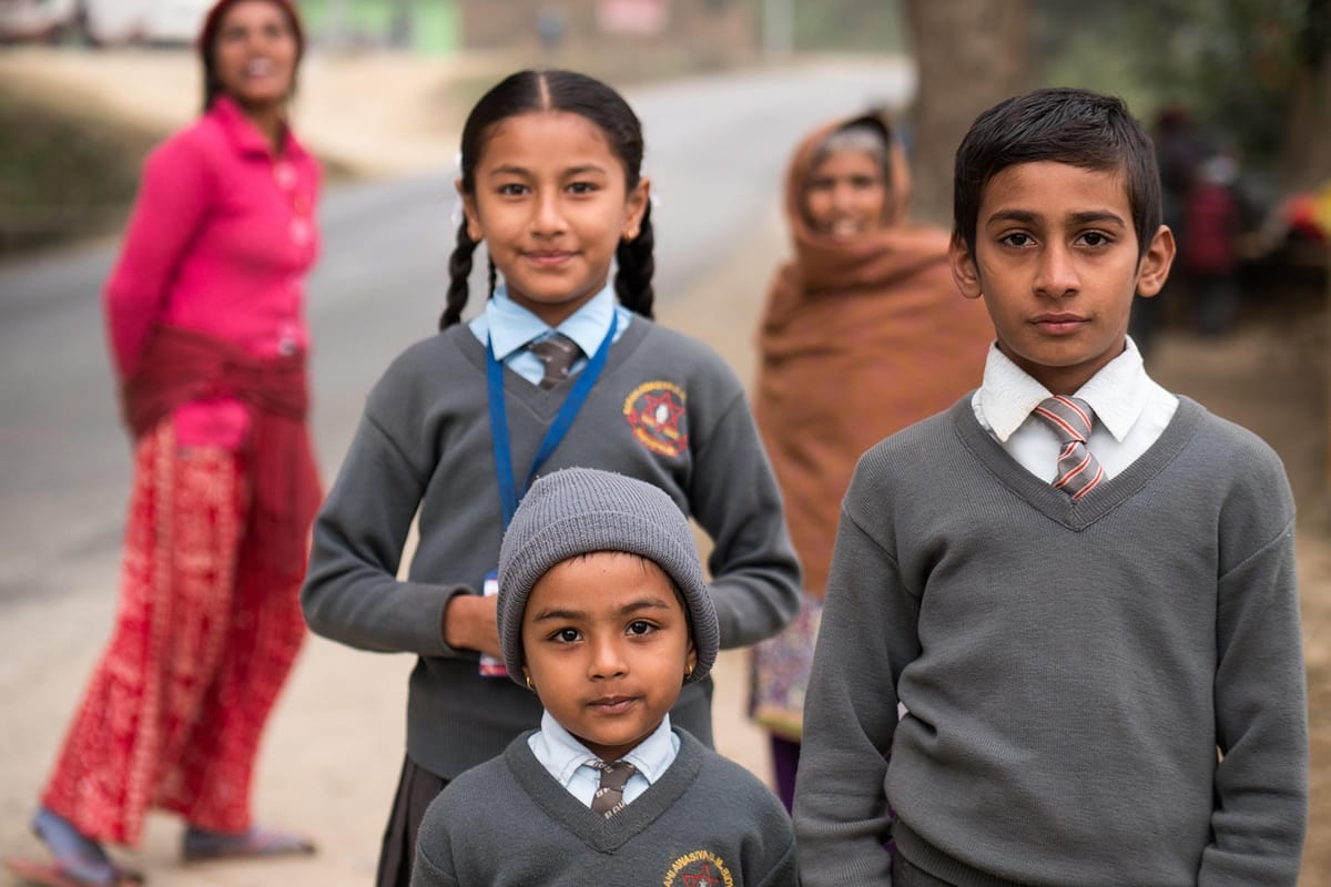 Students in a classroom in Nepal, representing the education sector