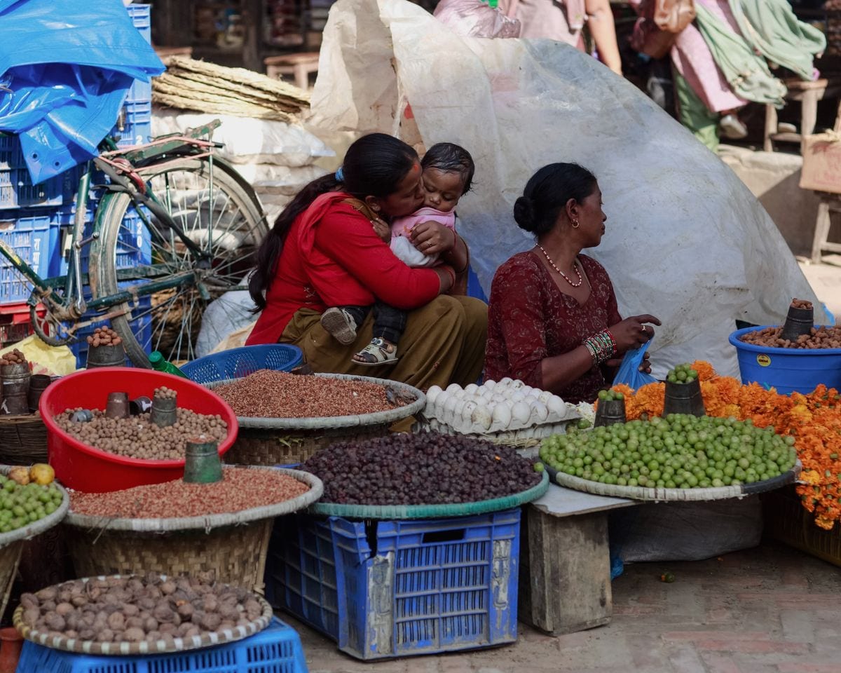 Vendors selling fresh produce at a busy Kathmandu street market