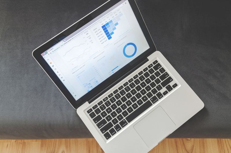 Laptop screen displaying analytics data and traffic graphs used during SEO analysis