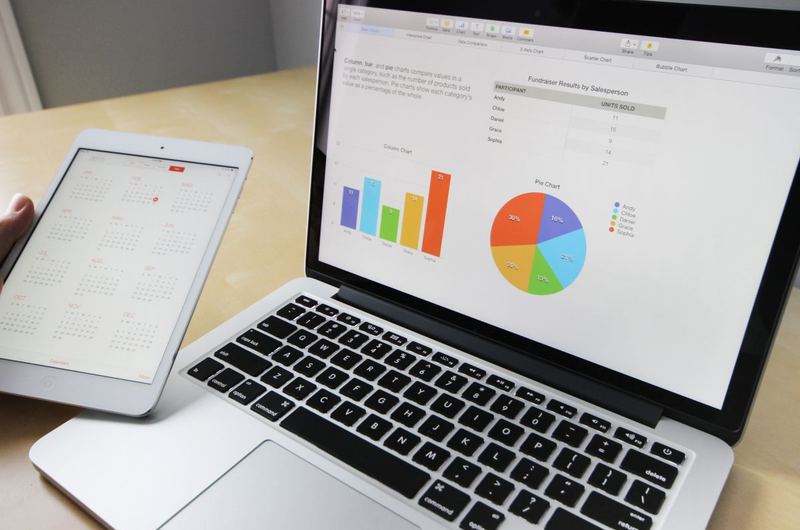 Analytics dashboard on a laptop showing organic traffic growth from SEO work