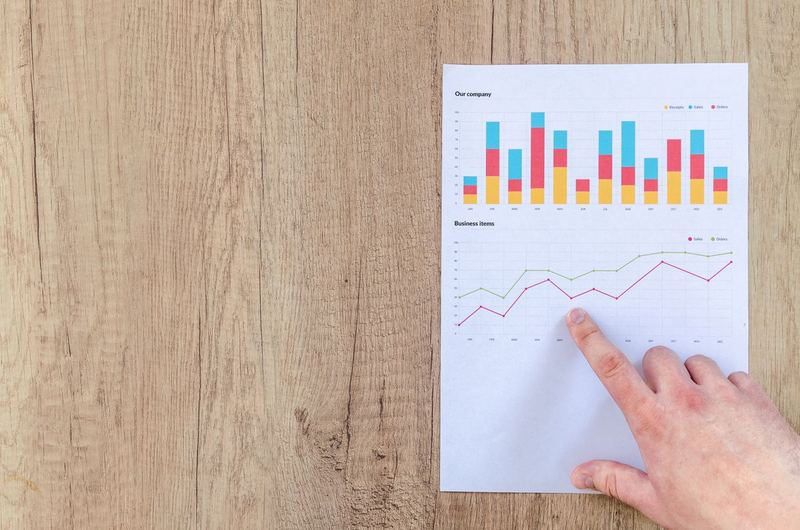 A magnifying glass over printed data, symbolizing the detailed analysis in an SEO audit