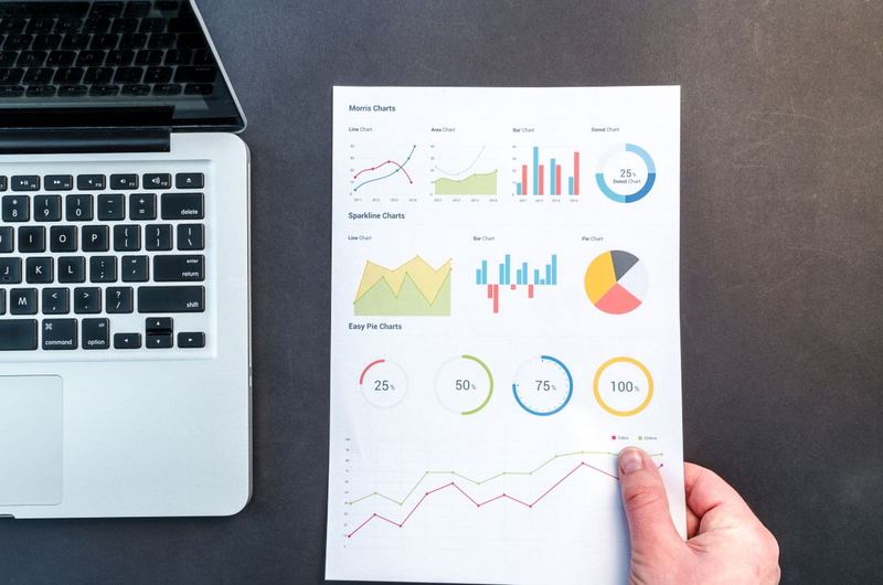 Charts and data reports laid out for analysis, representing SEO service planning