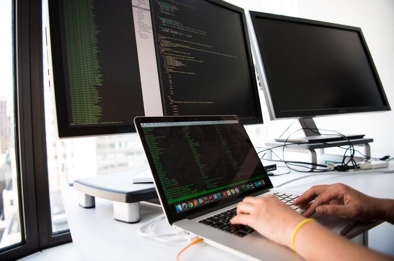 Code displayed on a monitor screen during a technical SEO audit